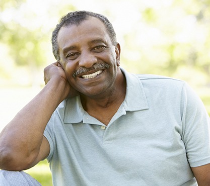 Man in polo shirt smiling