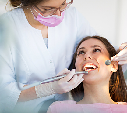 Woman receiving dental exam