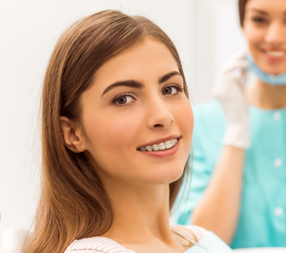 Woman in dental chair smiling