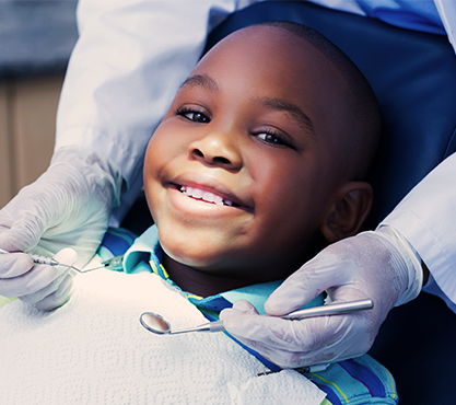 Smiling child in dental chair
