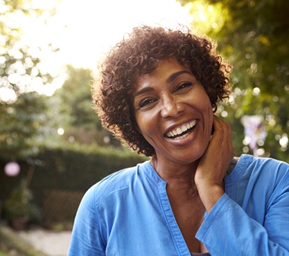 smiling woman in blue blouse