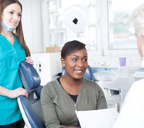 Patient talking to their dentist during consultation