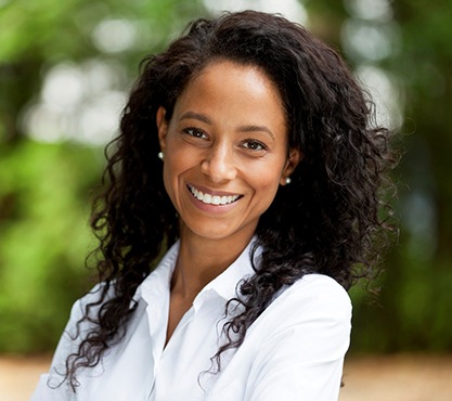 Smiling woman in white collared shirt