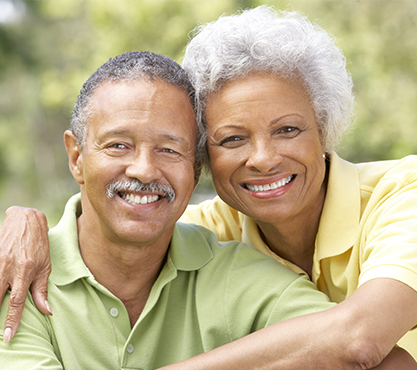 Smiling older man and woman outdoors