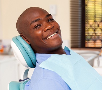 Smiling man in dental chair