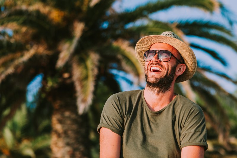 young man laughing during summer vacation